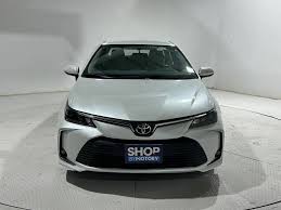 Silver sedan, front view in a studio